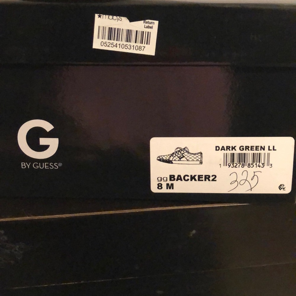 Dark green Guess sneakers.